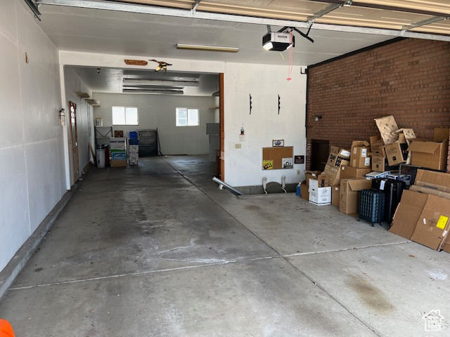 Garage featuring a garage door opener