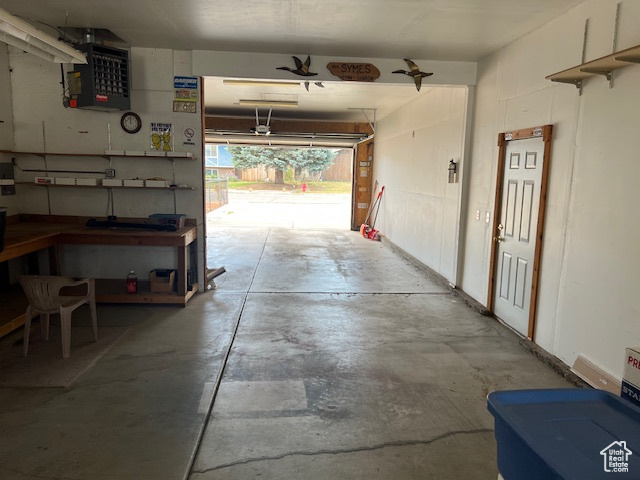Garage featuring a heating unit