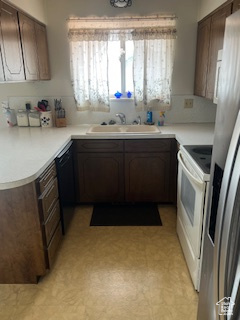 Kitchen featuring white electric range oven, a sink, light floors, stainless steel fridge, and black dishwasher