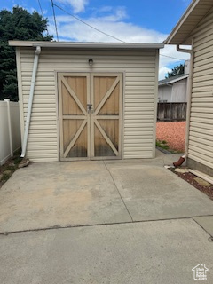 View of shed with fence