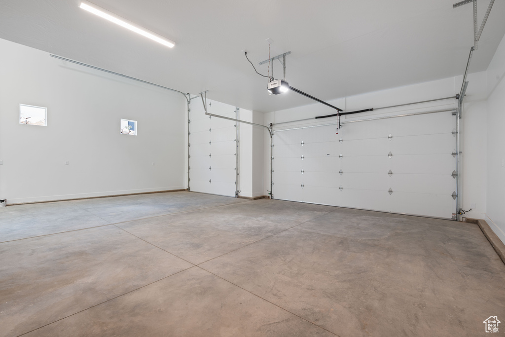 Garage featuring a garage door opener