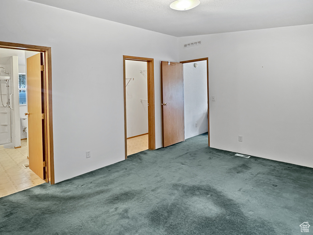 Unfurnished bedroom featuring carpet floors