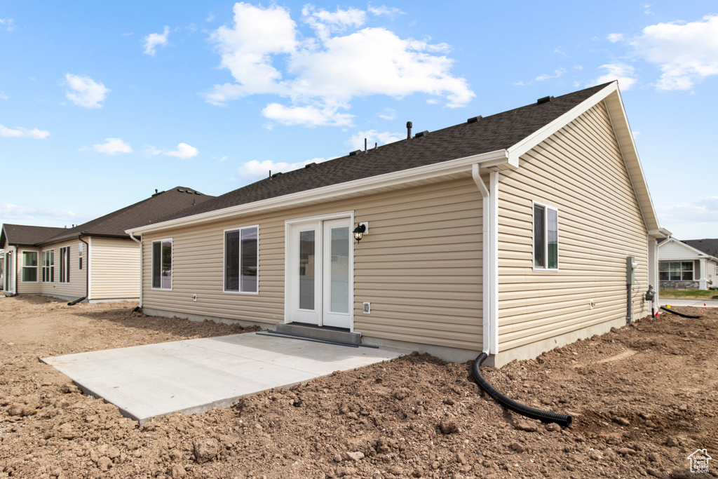 Rear view of house featuring french doors and a patio area