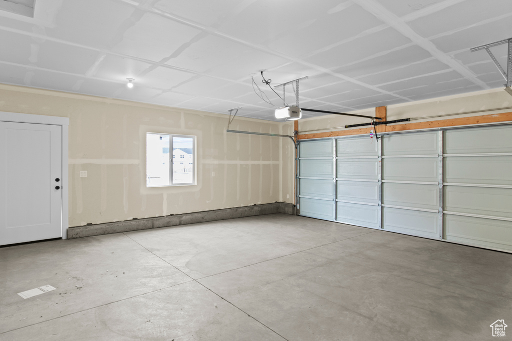 Garage featuring a garage door opener
