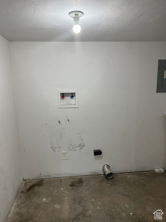 Laundry area with electric panel and hookup for a washing machine