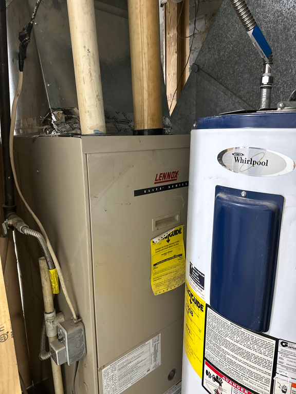 Utilities featuring water heater and heating unit
