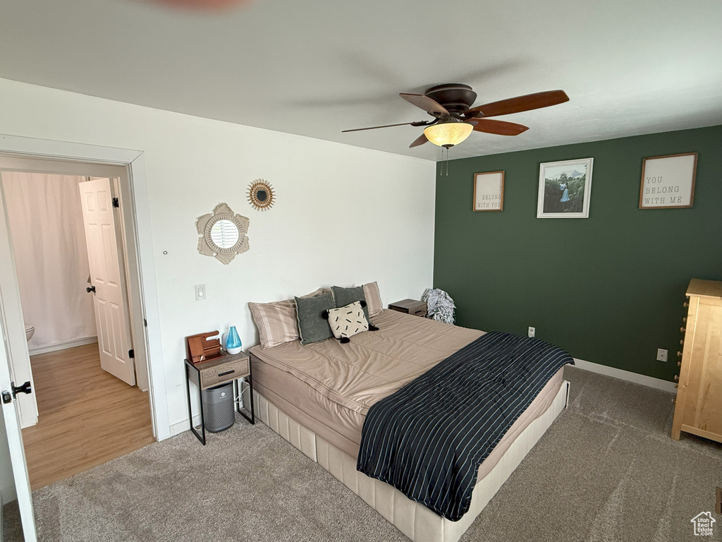 Bedroom with carpet flooring, baseboards, and ceiling fan