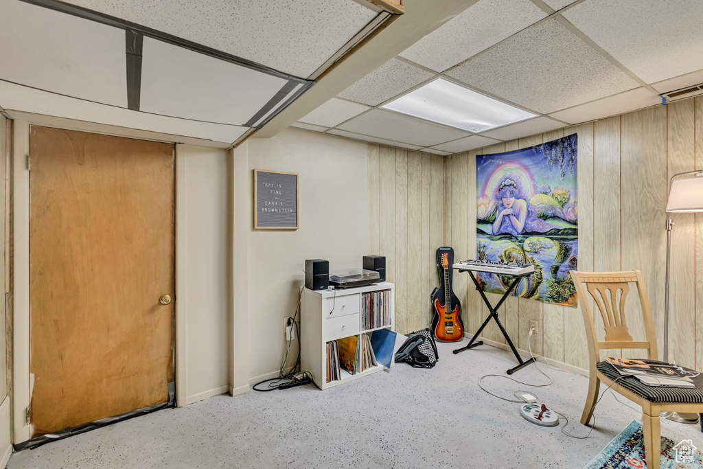 Miscellaneous room with baseboards and a paneled ceiling