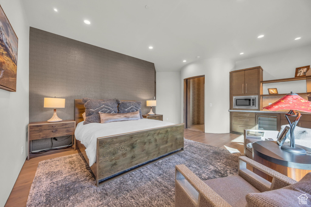 Bedroom with light wood-style floors and recessed lighting