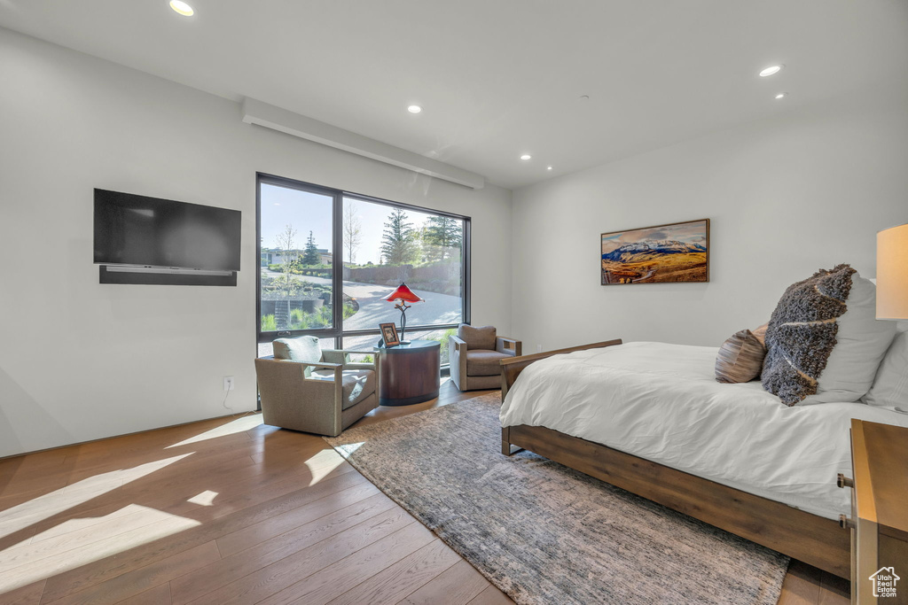 Bedroom with recessed lighting and wood-type flooring