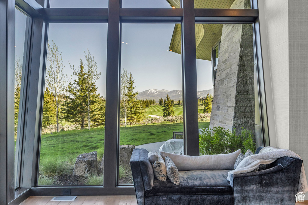 Doorway to outside featuring a mountain view, wood finished floors, and plenty of natural light