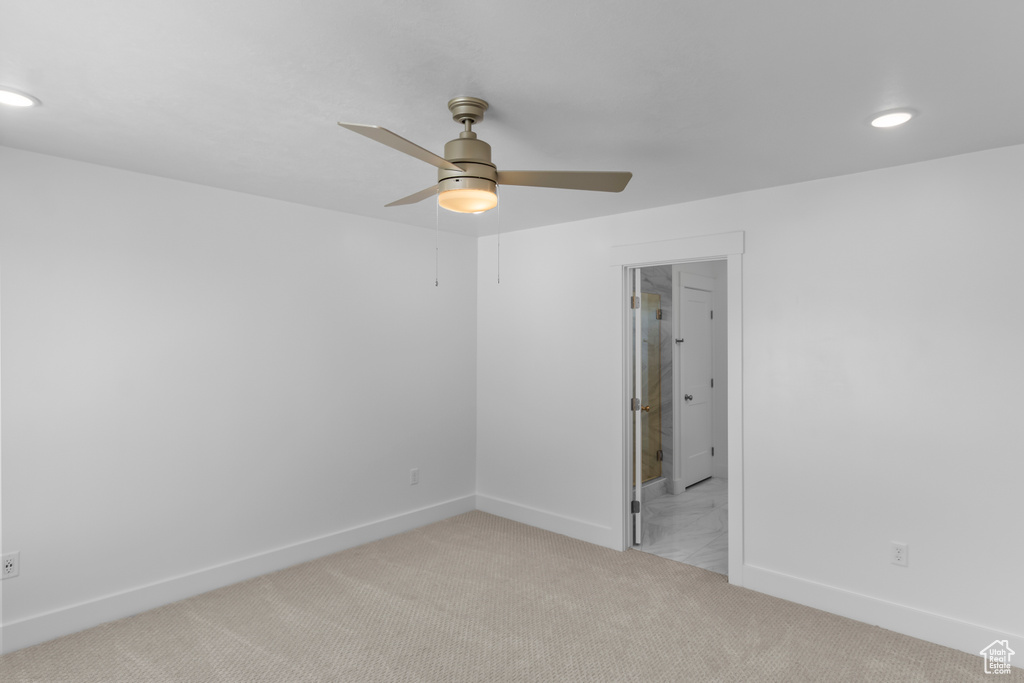 Carpeted empty room featuring recessed lighting, baseboards, and a ceiling fan
