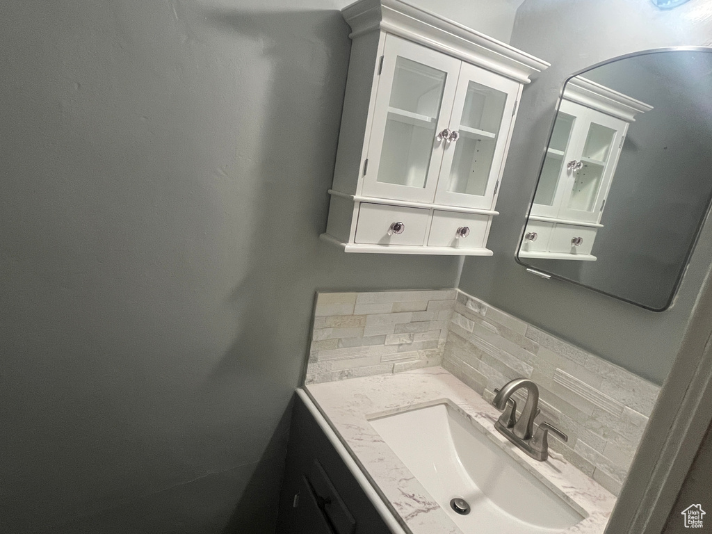 Bathroom with backsplash and vanity