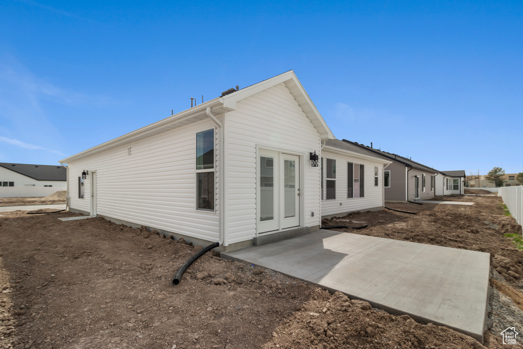Rear view of house featuring a patio