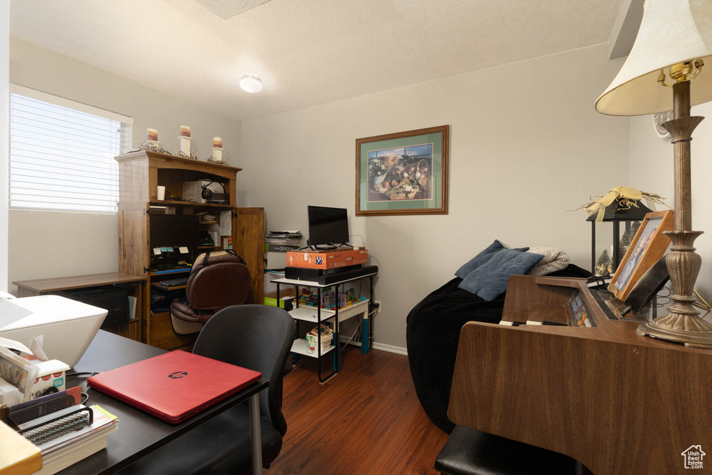 Office area with wood finished floors and baseboards
