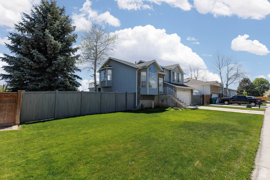 View of home's exterior featuring driveway