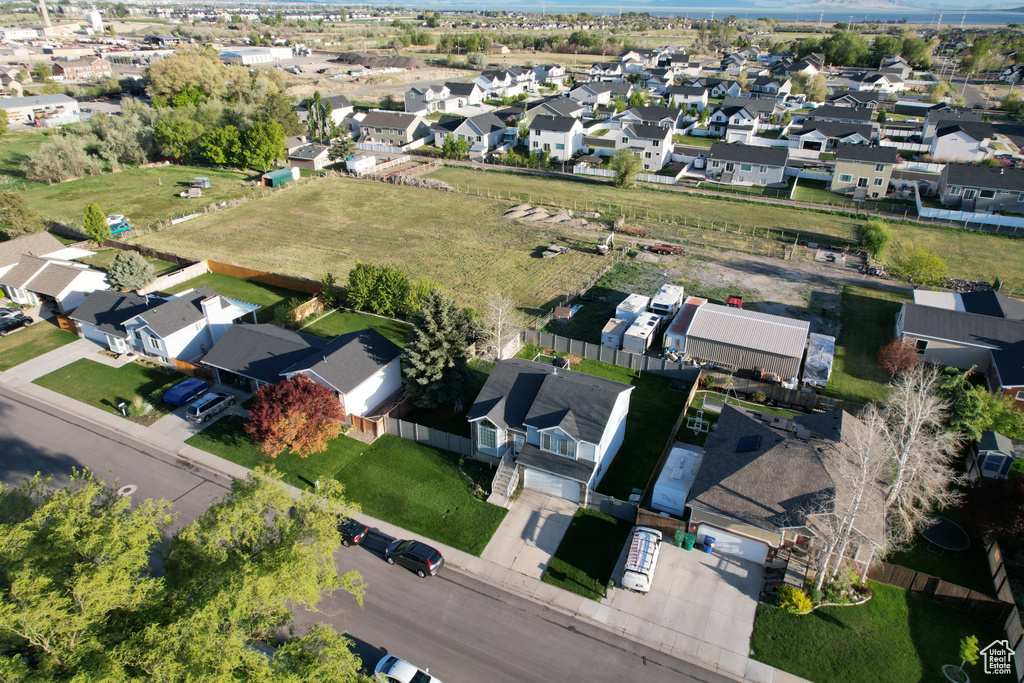 Aerial view of property's location with nearby suburban area