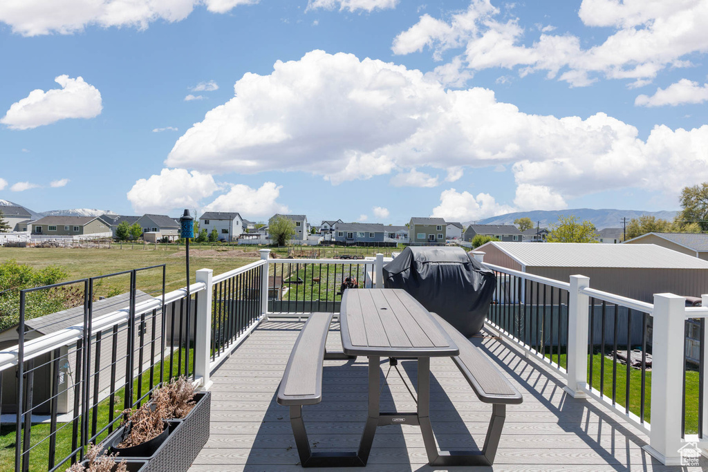 Wooden deck featuring a residential view
