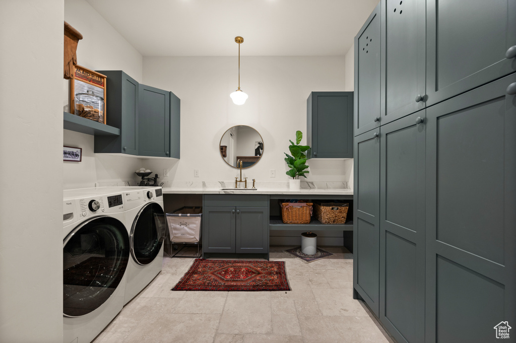 Laundry area featuring cabinet space and washing machine and dryer