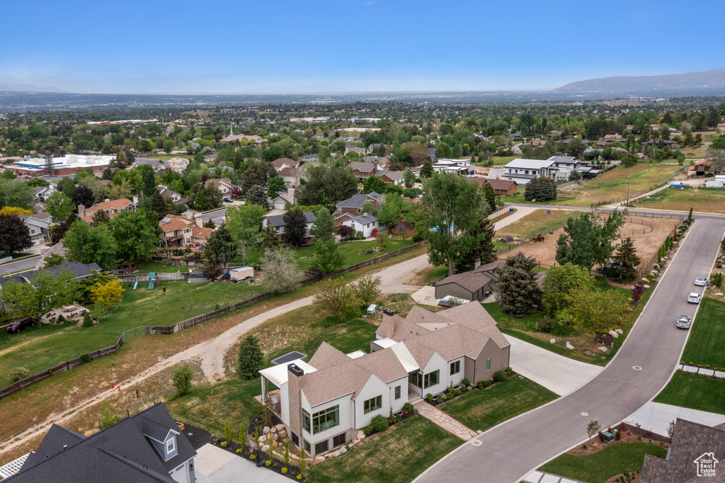 Aerial view of residential area featuring mountains