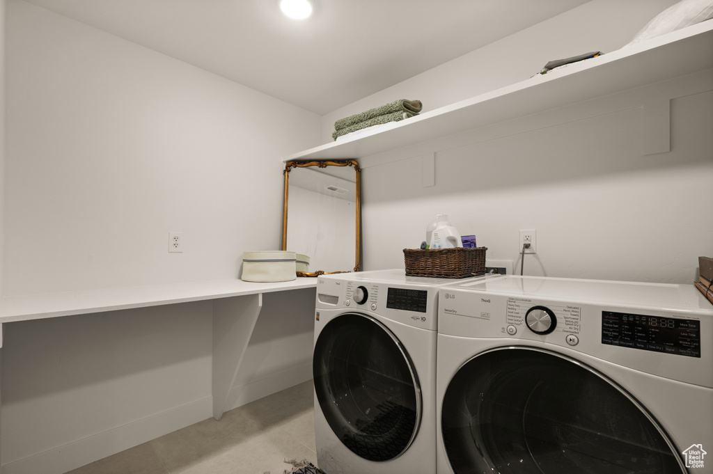 Clothes washing area with washer and clothes dryer