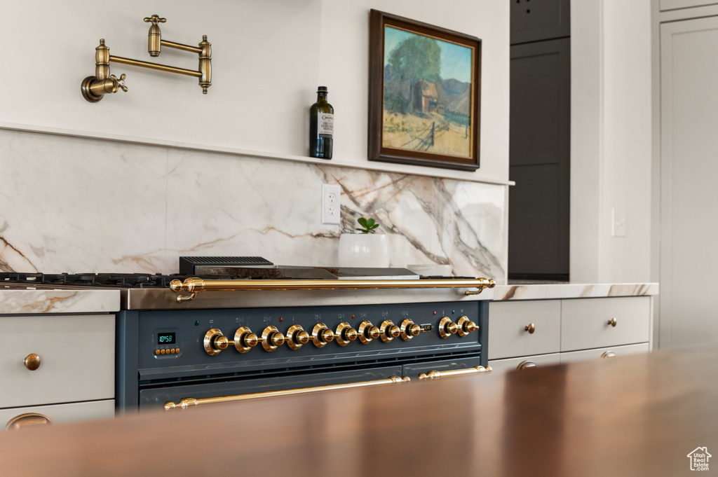 Kitchen view of tasteful backsplash and double oven range