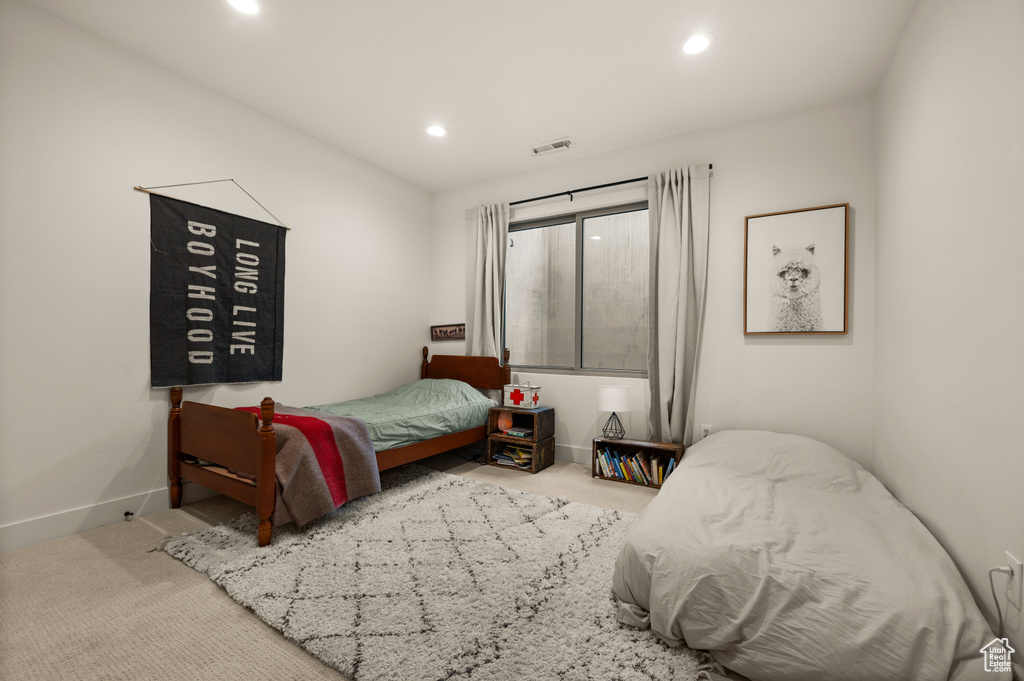 Bedroom featuring carpet flooring, recessed lighting, and baseboards