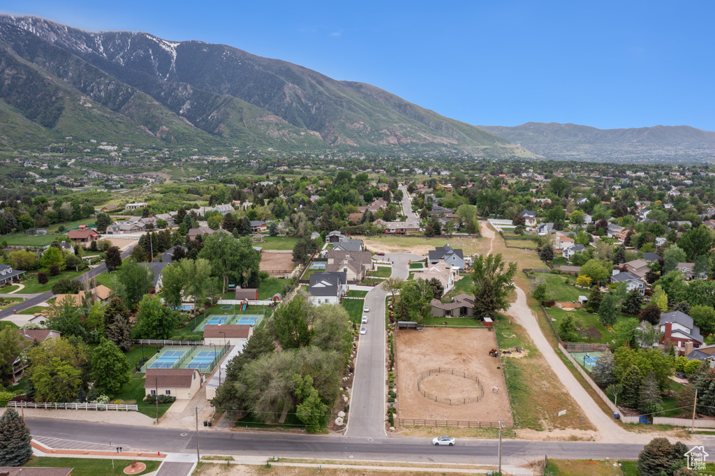 Aerial perspective of suburban area featuring a mountainous background