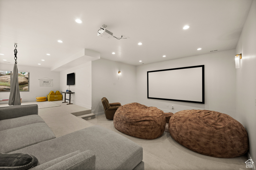 Cinema room with recessed lighting and carpet floors