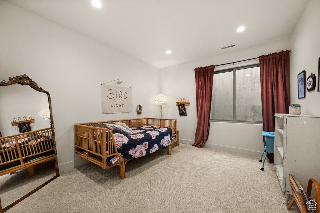 Bedroom featuring recessed lighting, carpet, and baseboards