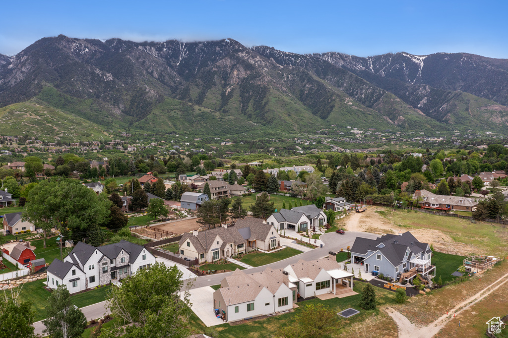 Aerial view of residential area featuring mountains