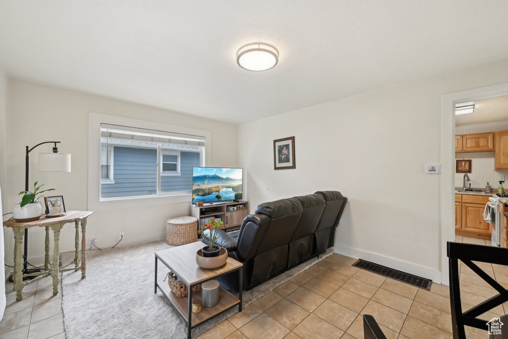 Living area with light tile patterned floors