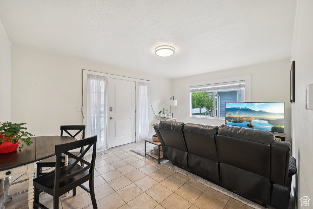 Living area featuring light tile patterned floors