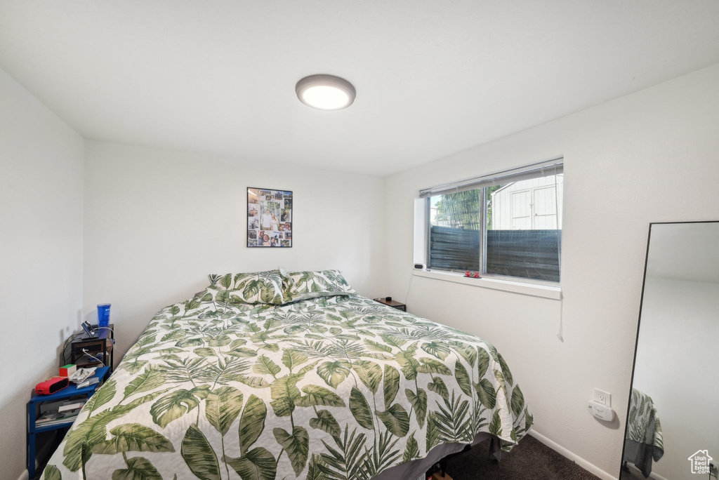 Bedroom with carpet and baseboards