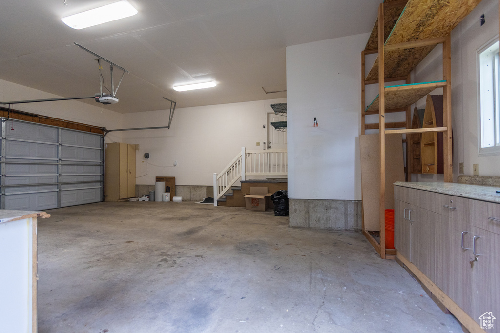 Garage featuring a garage door opener
