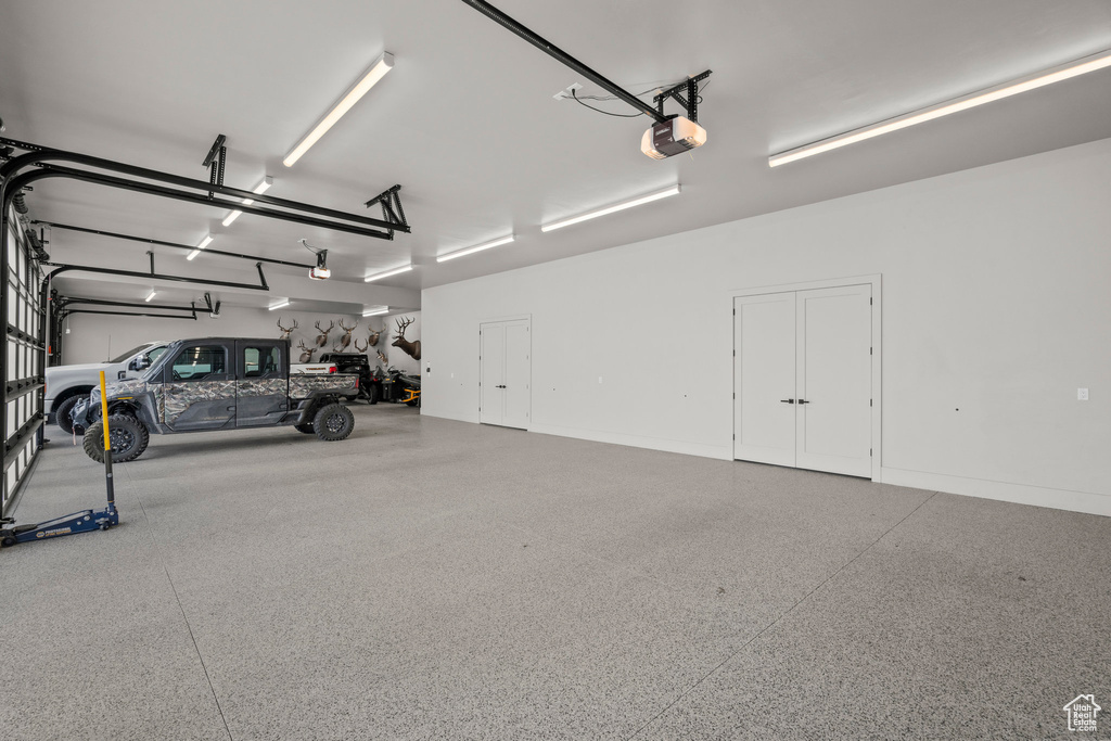Garage featuring a garage door opener