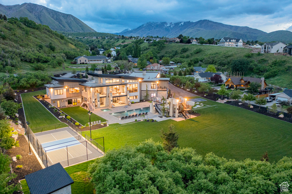 View of subject property with a mountainous background