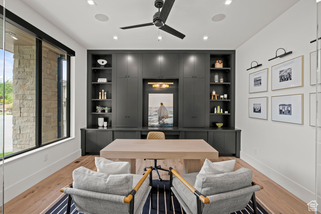 Office featuring built in shelves, baseboards, a ceiling fan, light wood finished floors, and recessed lighting