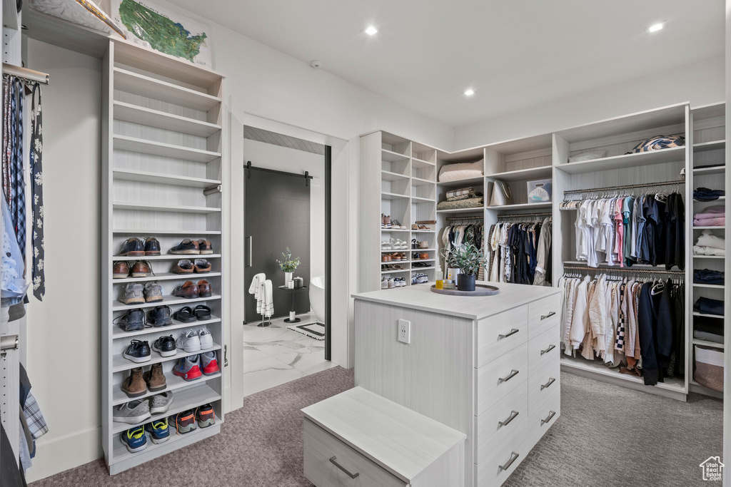 Walk in closet featuring carpet floors