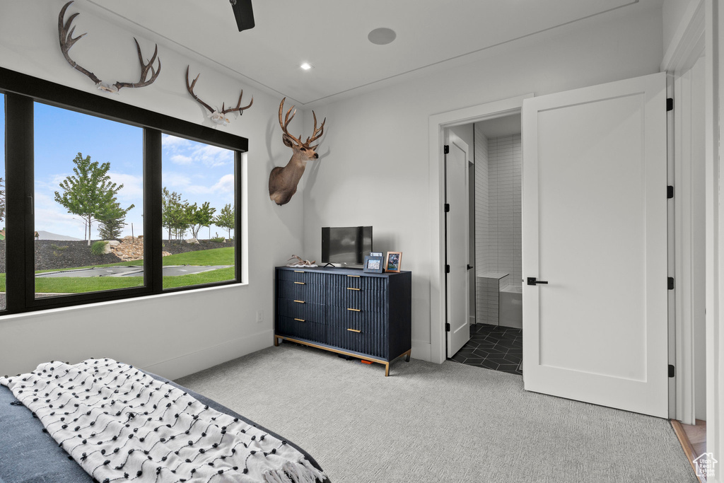 Carpeted bedroom with recessed lighting and ensuite bathroom