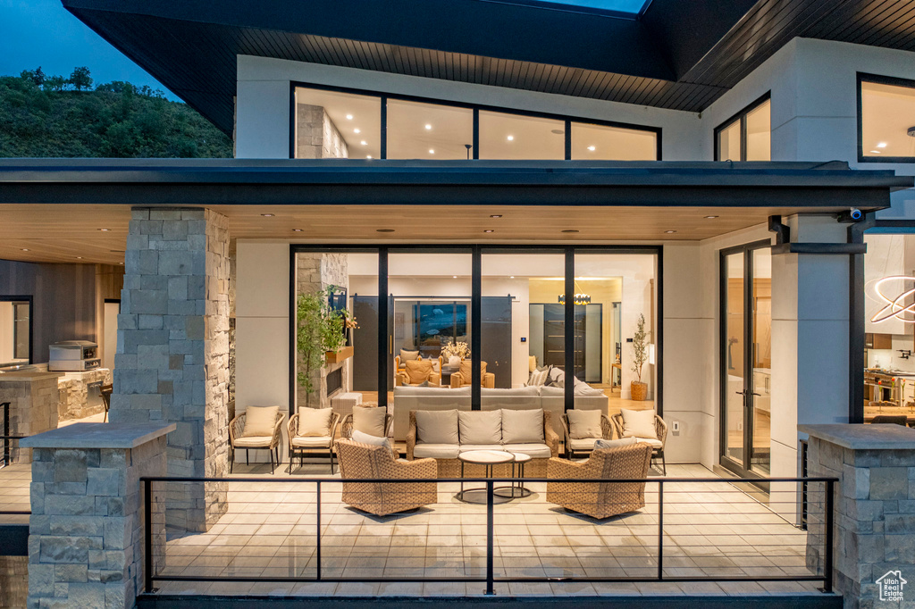 Rear view of house featuring outdoor lounge area