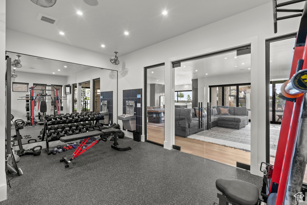 Exercise room featuring recessed lighting