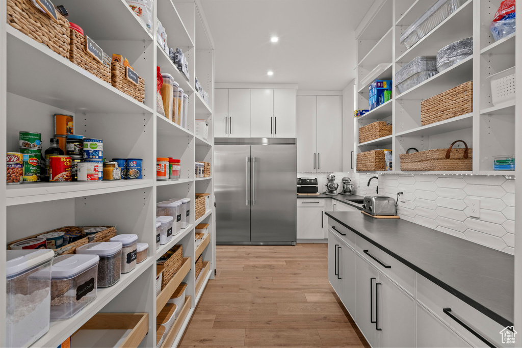 Pantry featuring a sink