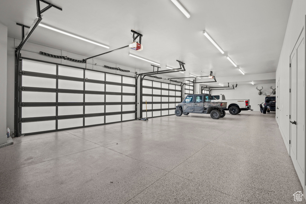 Garage featuring a garage door opener