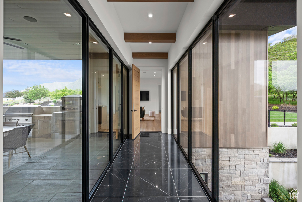 Hall featuring recessed lighting and beam ceiling