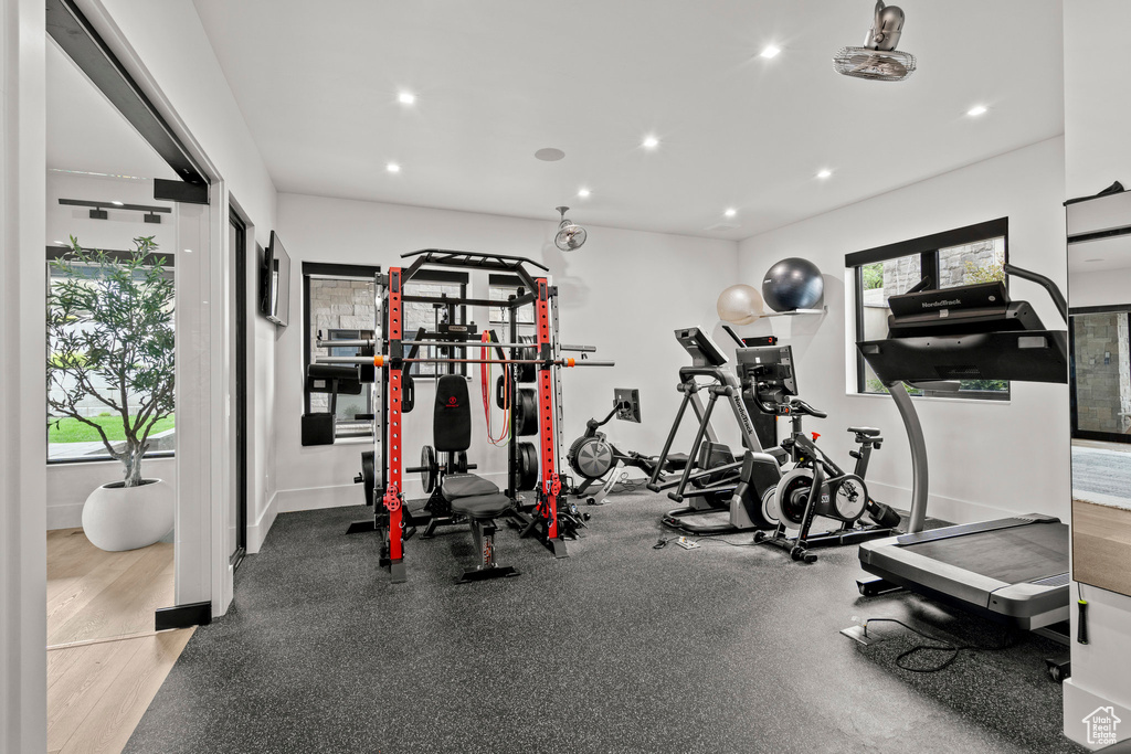 Gym featuring plenty of natural light, recessed lighting, and baseboards