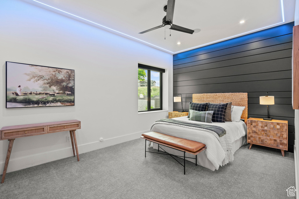 Carpeted bedroom featuring baseboards, recessed lighting, and ceiling fan
