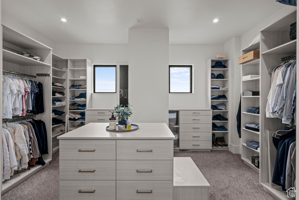 Spacious closet with carpet flooring