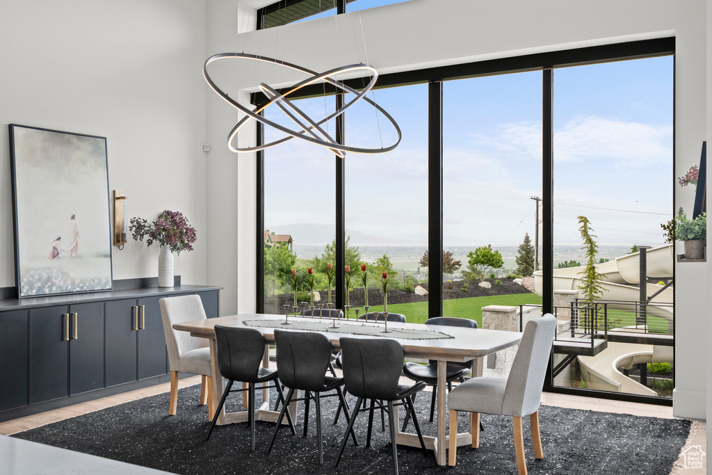 Dining room featuring healthy amount of natural light and wood finished floors