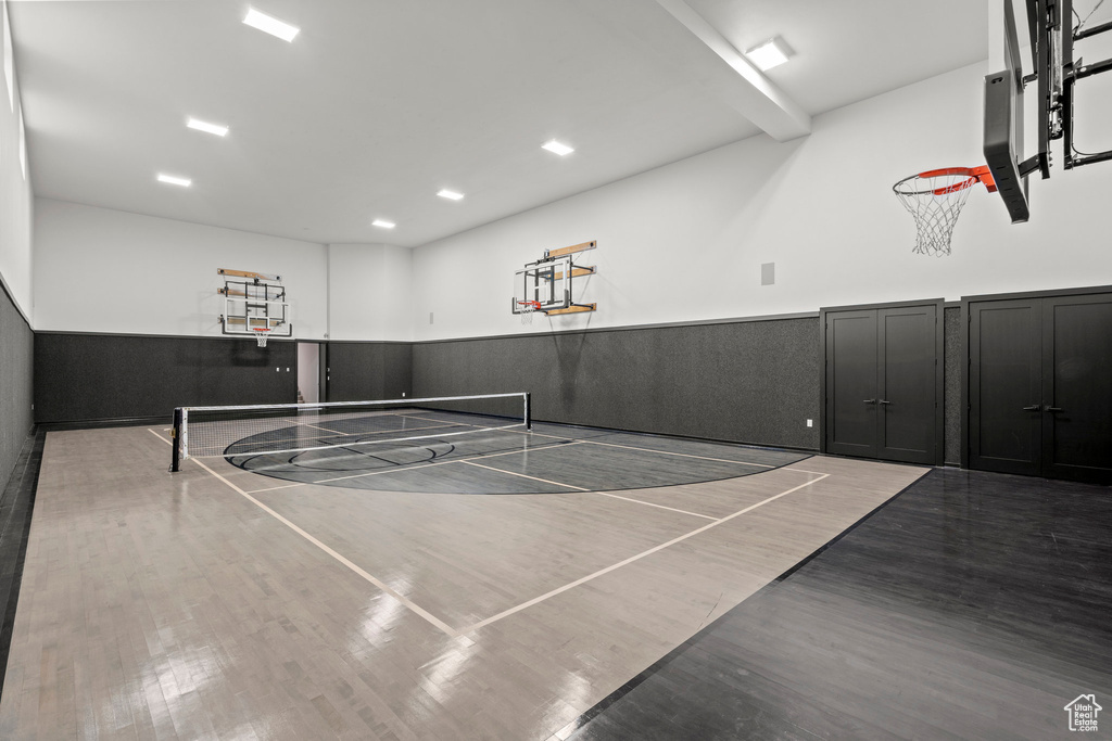 View of sport court featuring community basketball court, a tennis court, and fence